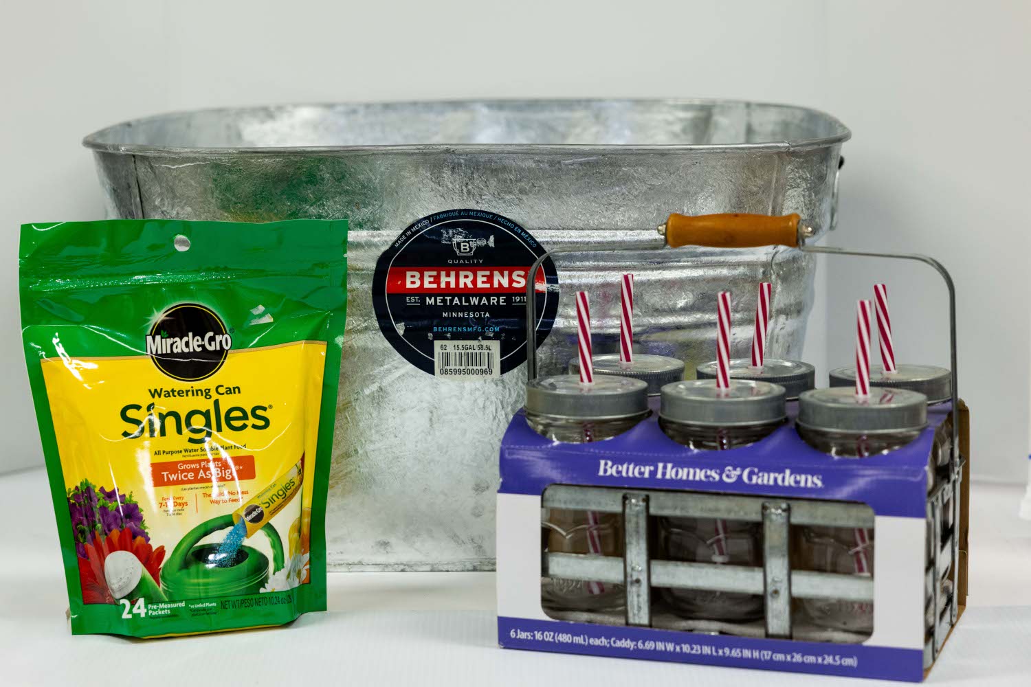 Lot 25 - Galvanized Bucket, Miracle Grow Watering Can Singles, Glass Jars with Straws